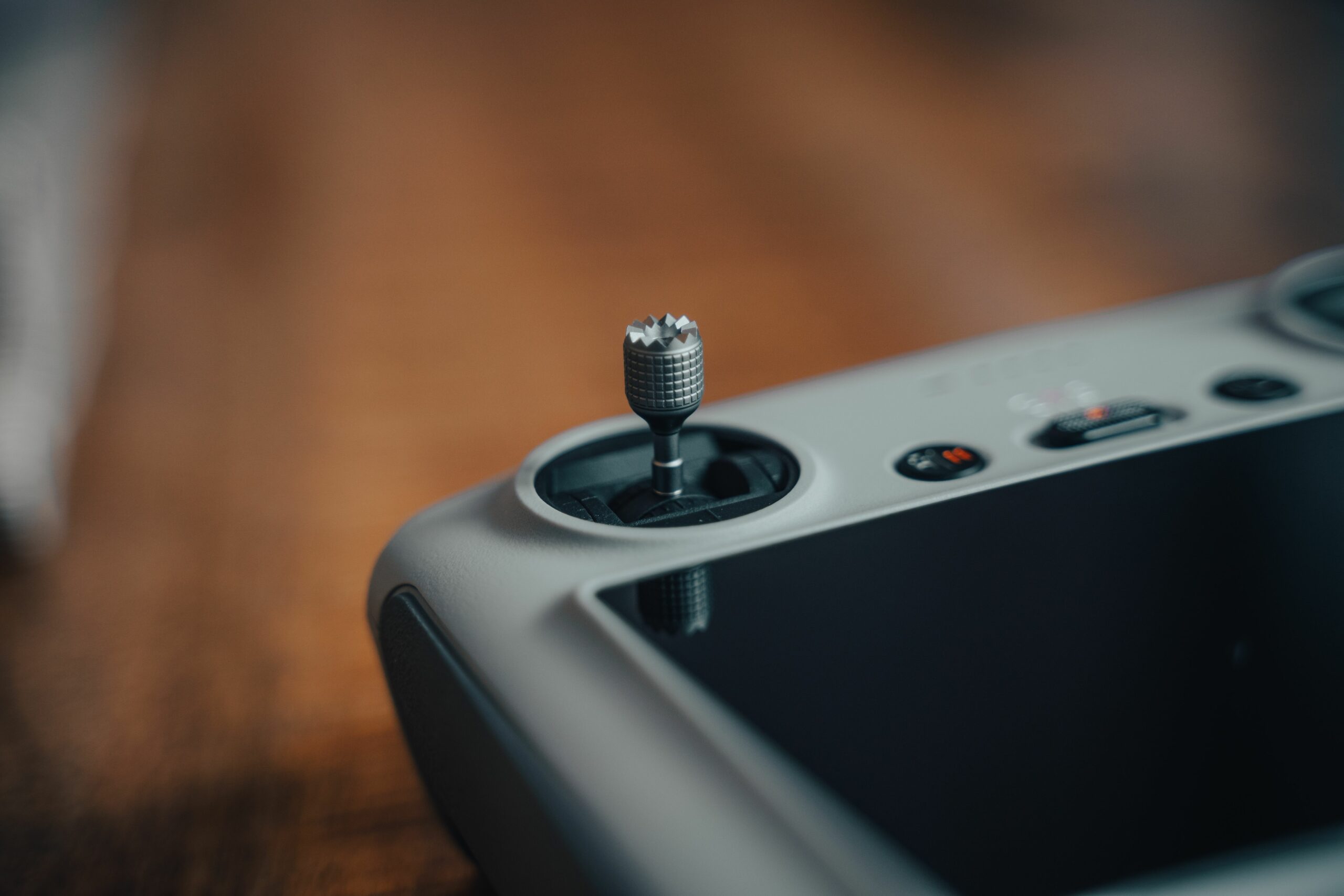 Detailed view of a drone controller joystick, showcasing precision technology.