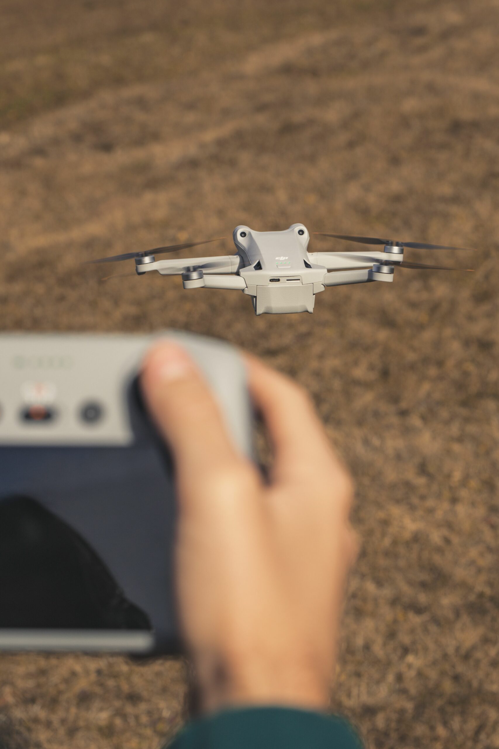 Close-up of a drone flying over a field in Trentino-Südtirol, Italy.